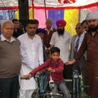 Tricycle & Wheel chair distribution to Handicaps. 